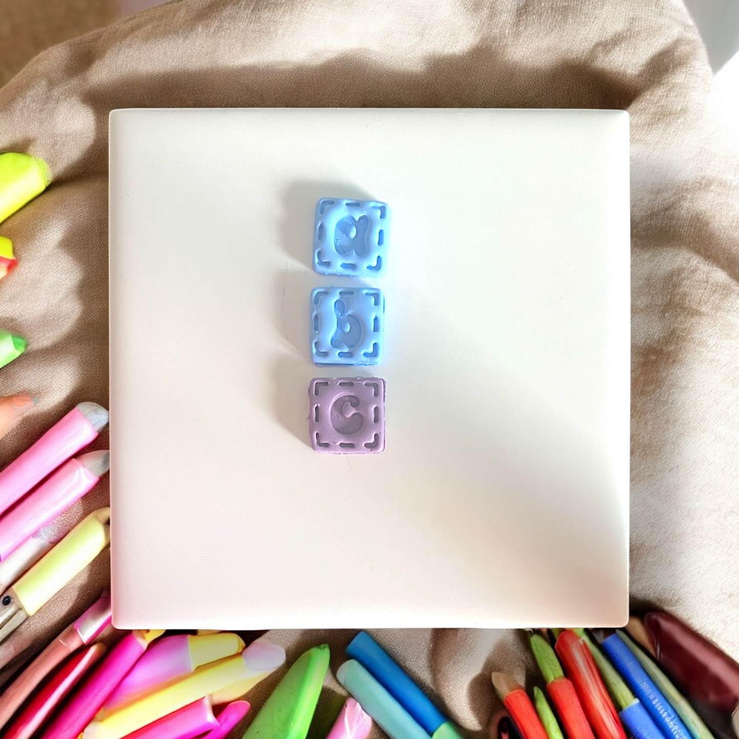 Colorful markers with a white square in the center