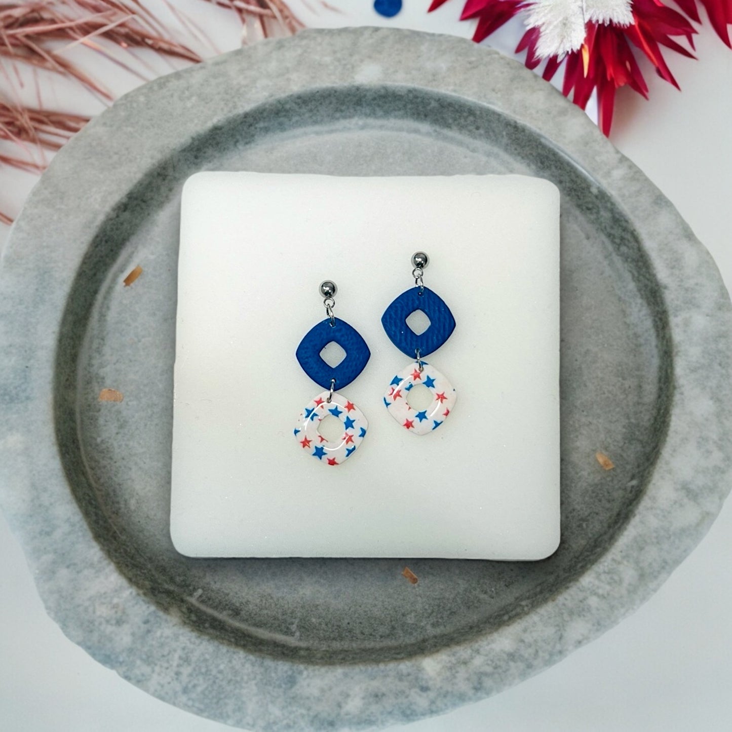 Festive 4th of July puffy rhombus dangle earrings in red, white, and blue, perfect for adding a patriotic touch to any outfit.