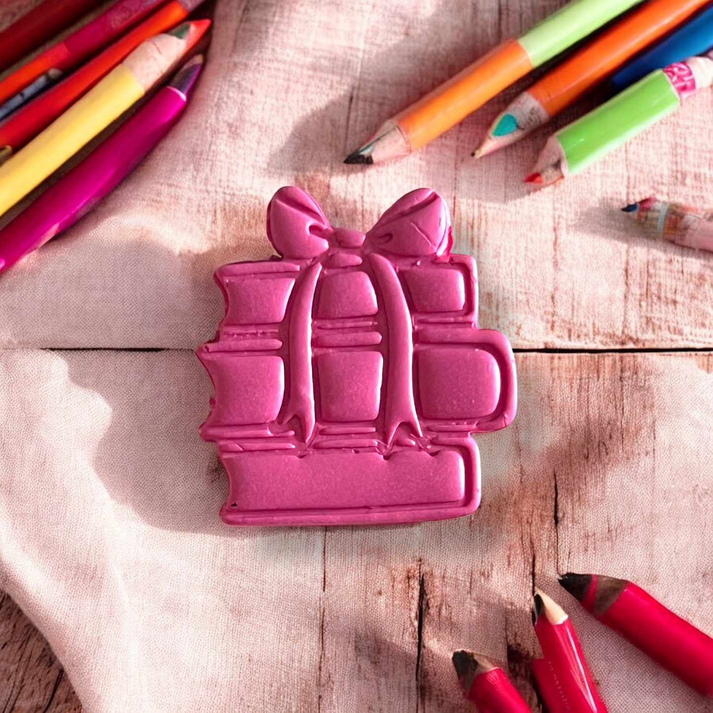 Pink stack of books with bow