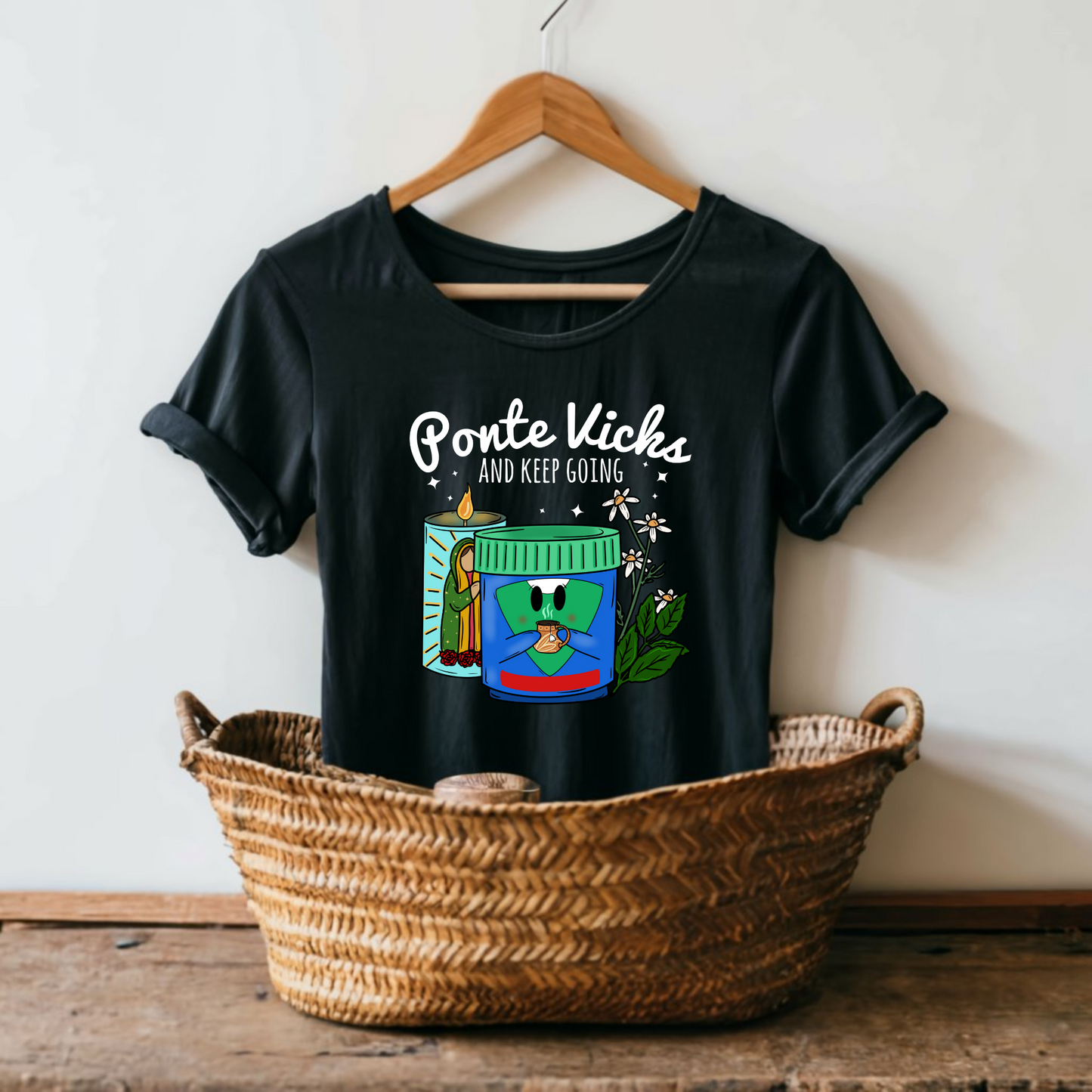 Flat lay of Ponte Vicks and Keep Going T-Shirt showcasing a playful graphic design on a Women’s Next Level black fitted tee.