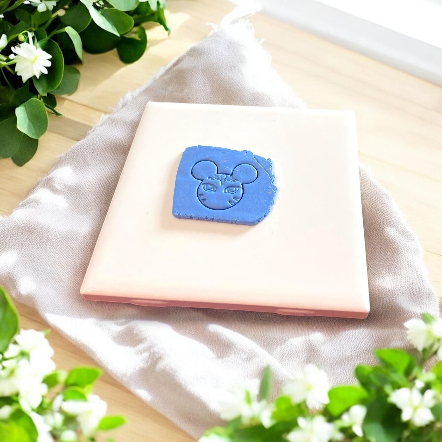 Blue tribal face clay impression