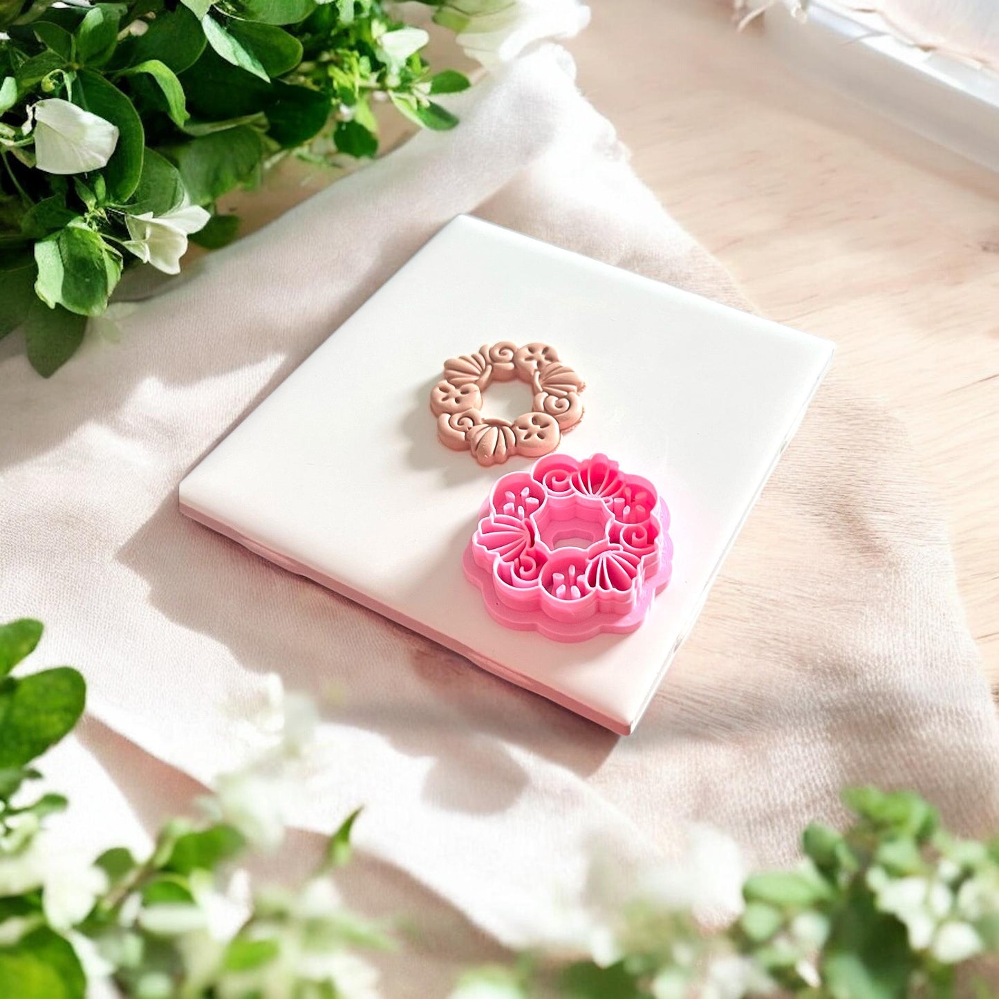finished polymer piece with pink shell wreath cutter