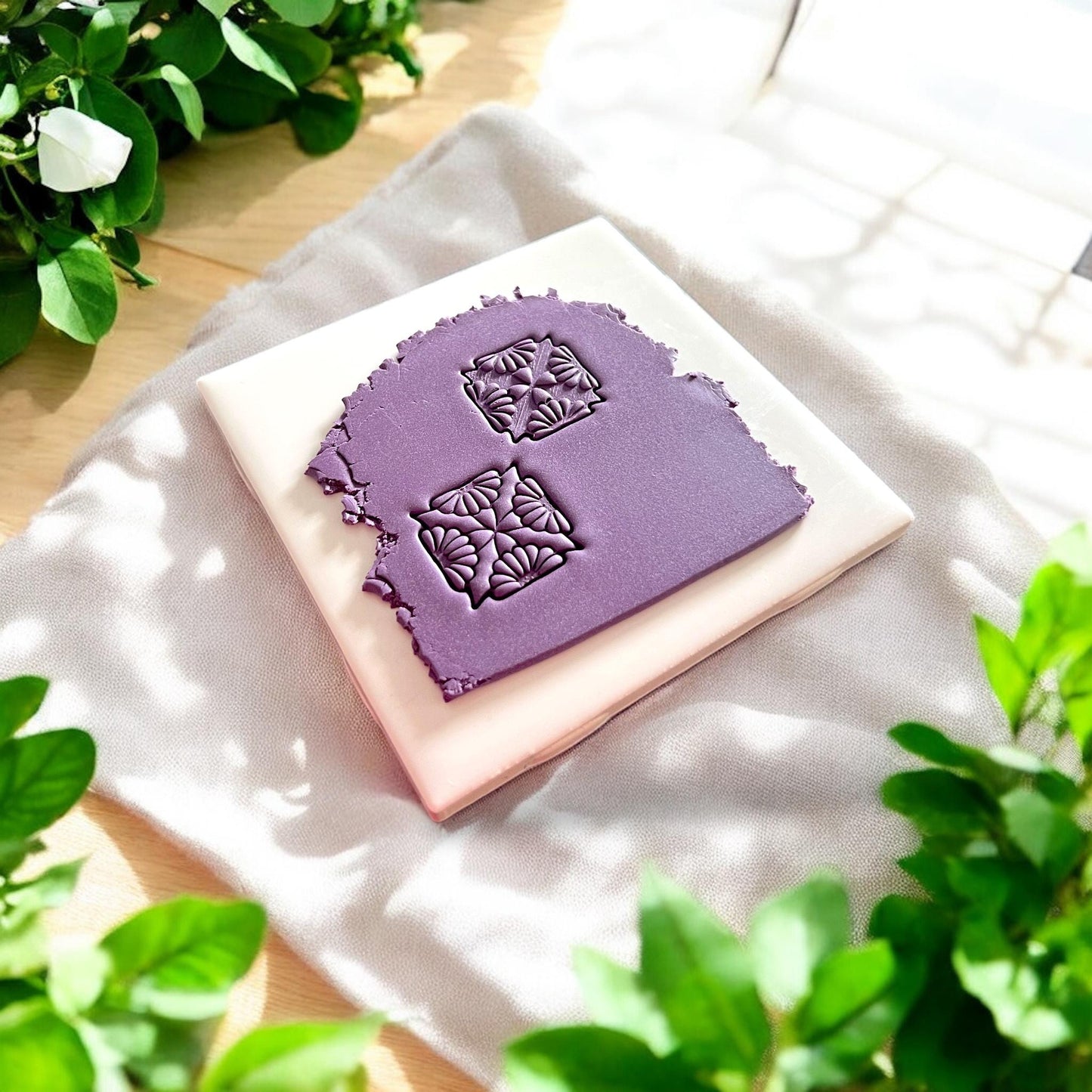 purple clay slab with two floral impressions