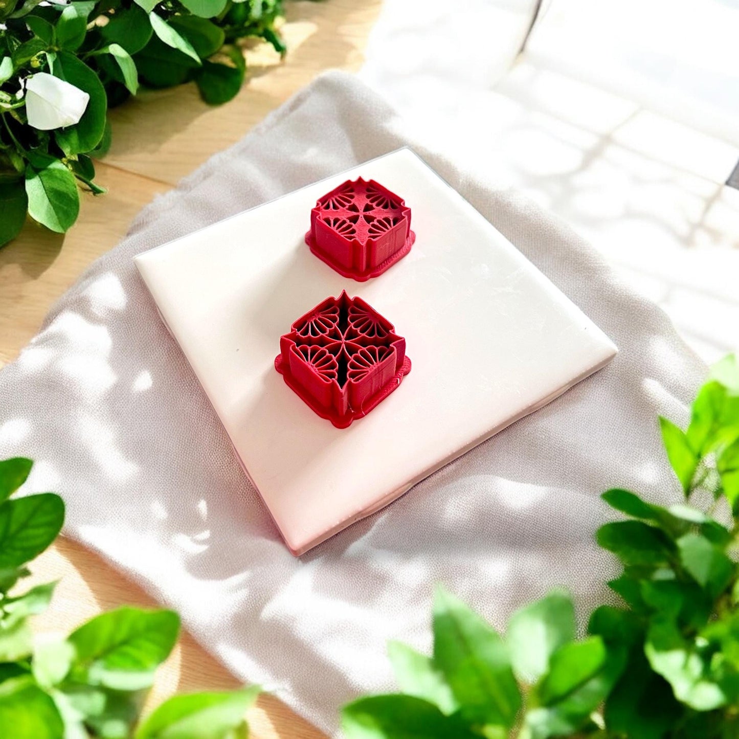 red embossed and debossed floral cutters on tile