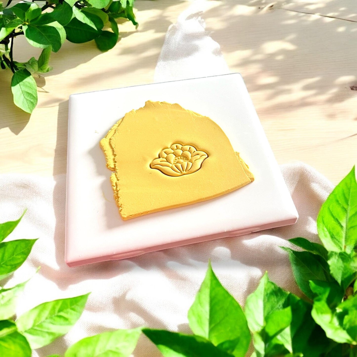 clay slab with floral design imprint