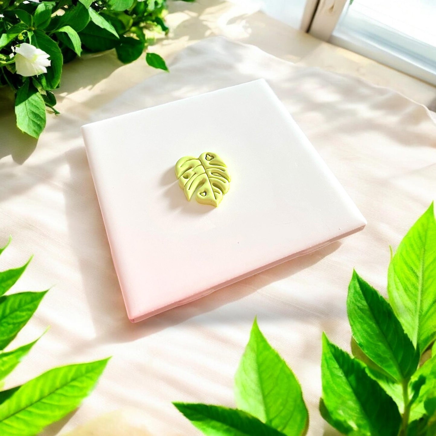 finished green clay leaf cutout with heart details
