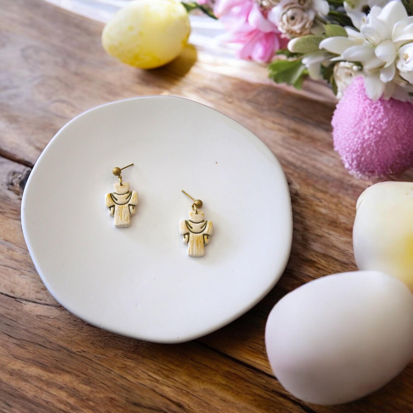 finished cross earrings on plate