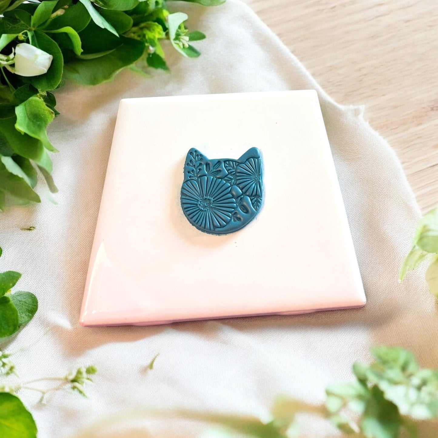Close-up view of the floral kitty cutter showcasing its detailed feline and floral patterns for clay art.