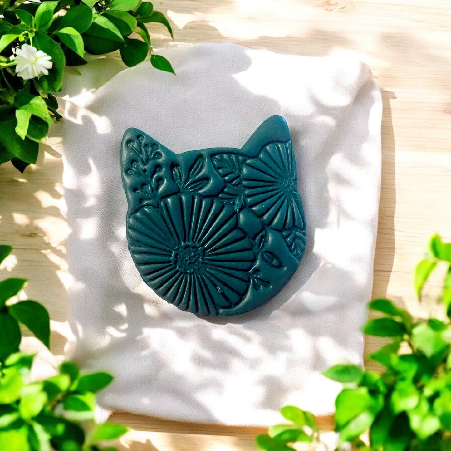 Close-up view of the floral kitty cutter showcasing its detailed feline and floral patterns for clay art.