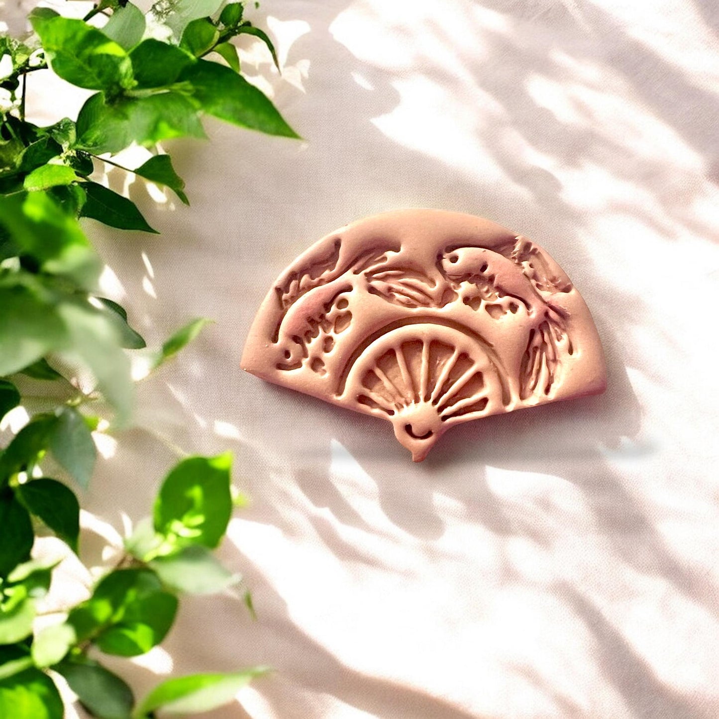 Finished koi fish fan polymer clay piece, detailed and intricate with koi and fan motif