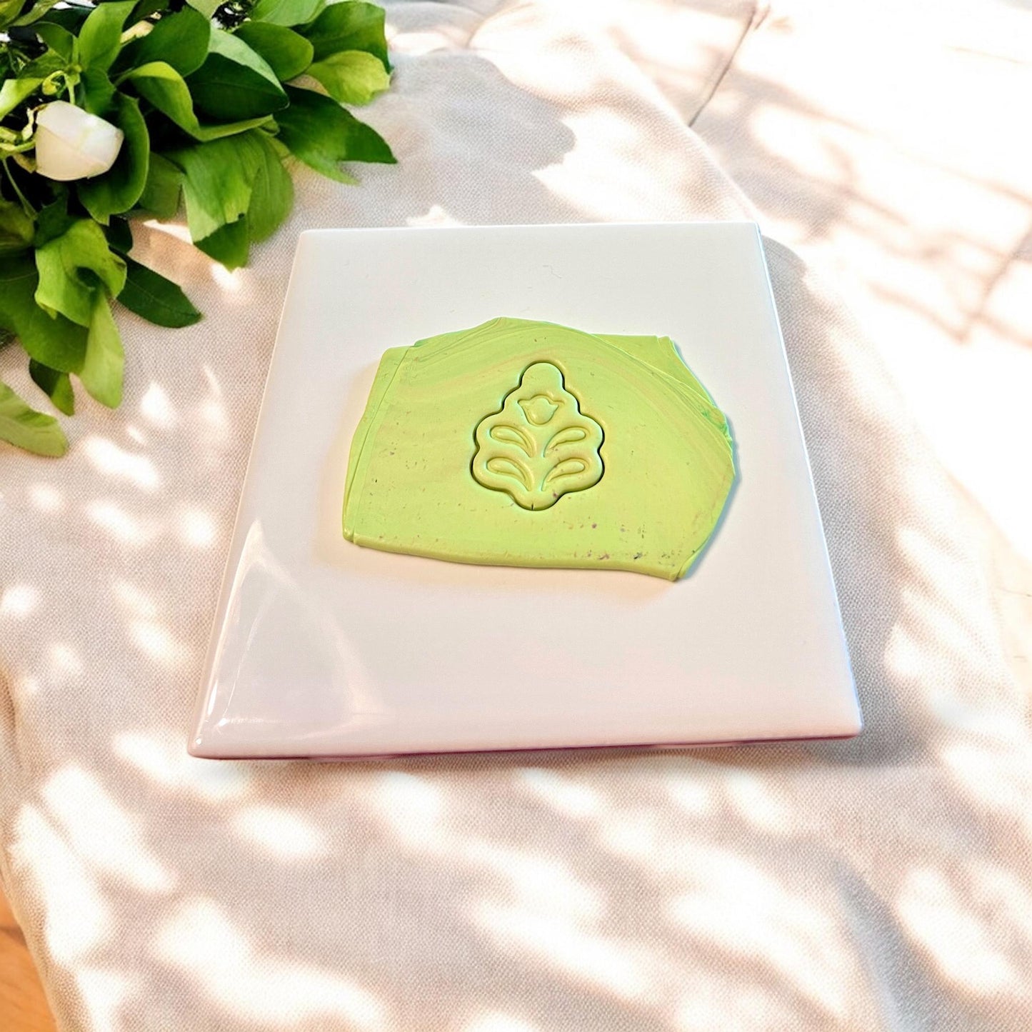 Clay sheet with embossed Scandinavian flower design in green