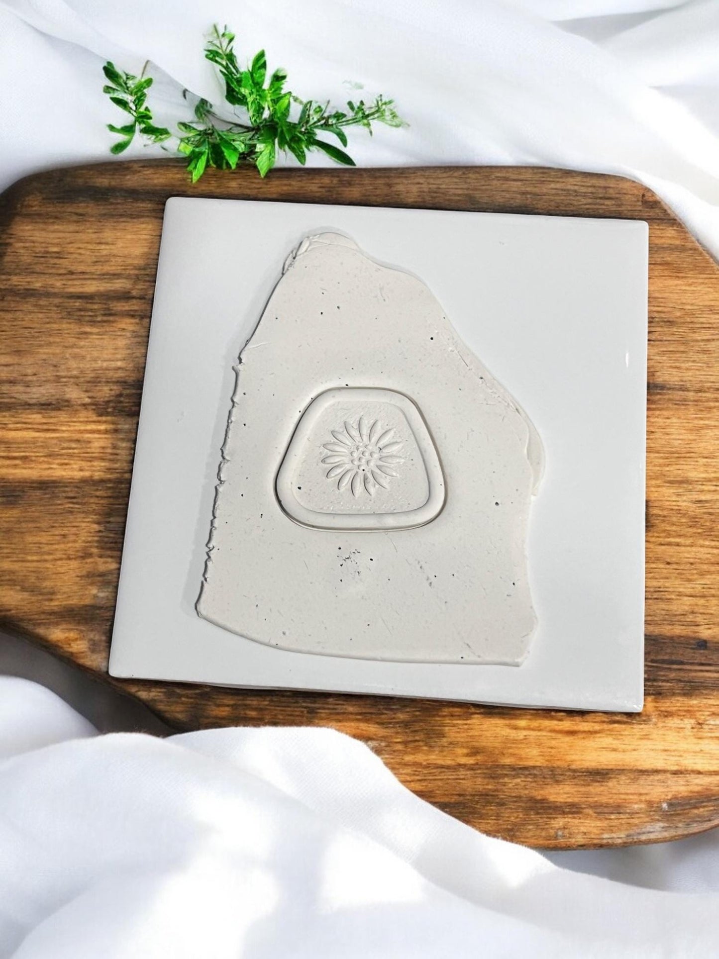 Polymer clay pressed with sunflower emboss in triangle shape