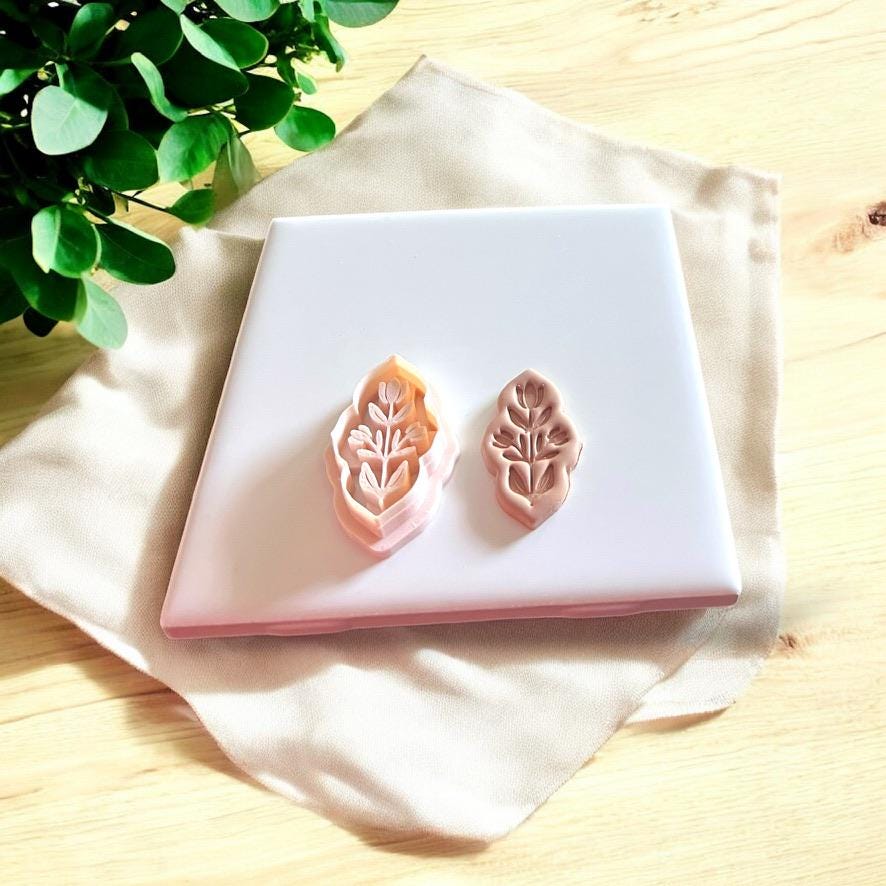 Embossed clay cutter shown next to matching pressed clay result