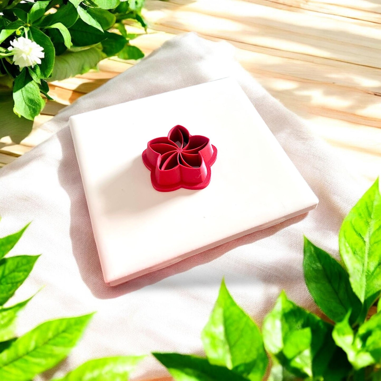 red plumeria flower-shaped cutter on display