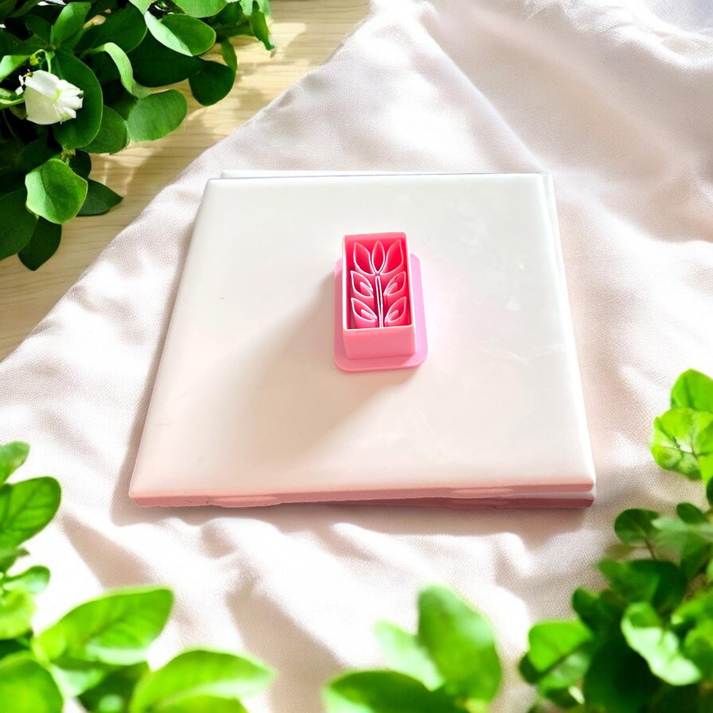 pink tulip rectangle clay cutter on white tile