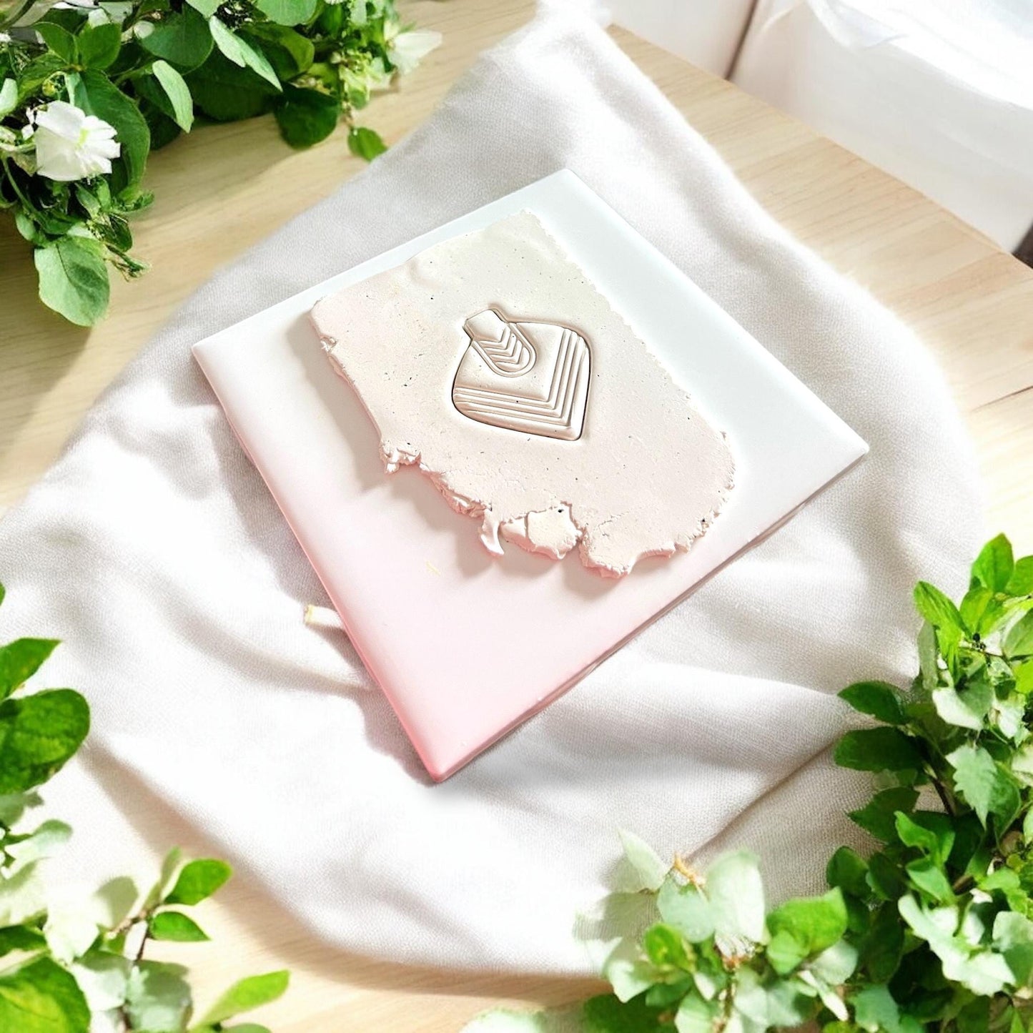 neutral clay slab with chevron pendant imprint
