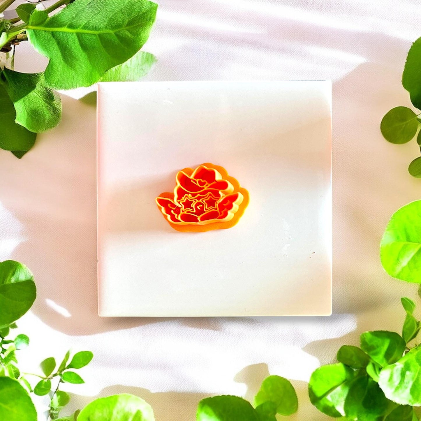 Set of western cupid polymer clay cutters displayed on a white surface, highlighting the intricate design.