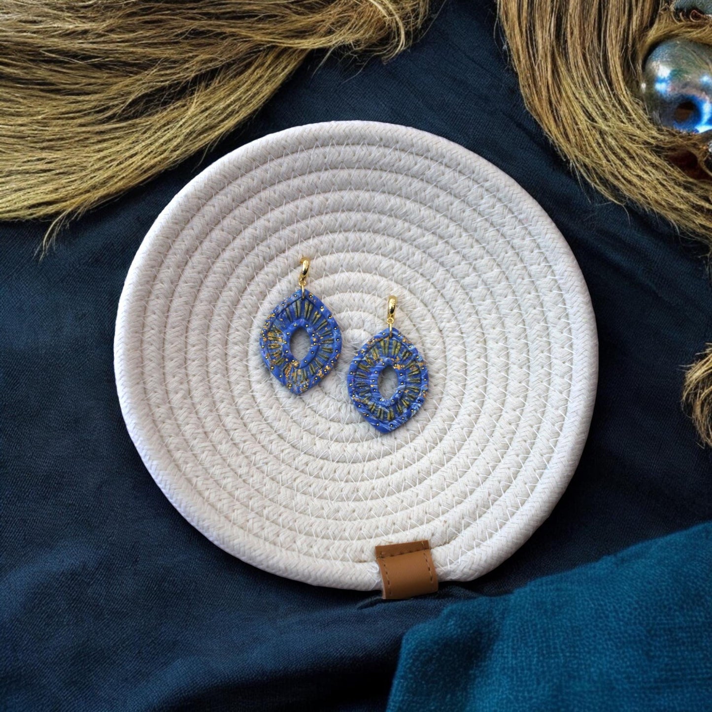 example earrings made with boho eye clay cutter