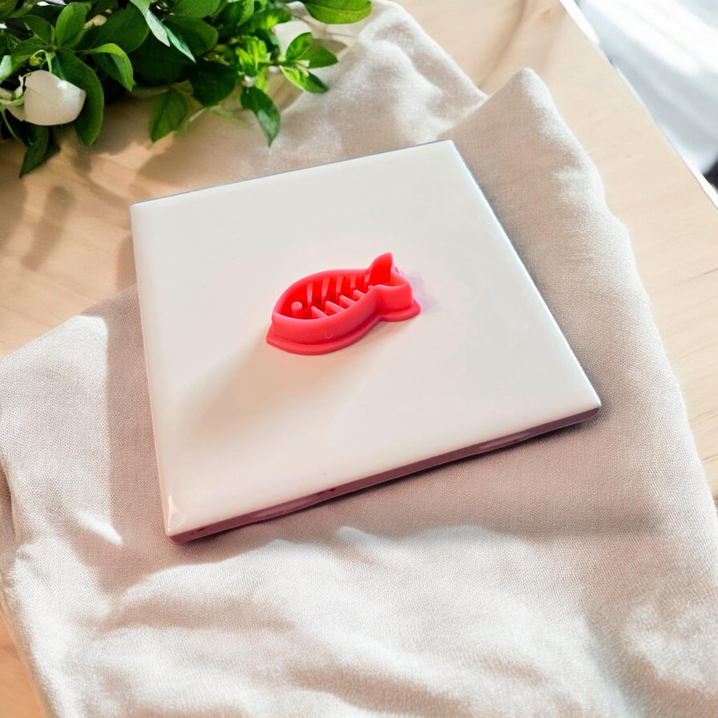 fishbone cutter on white tile