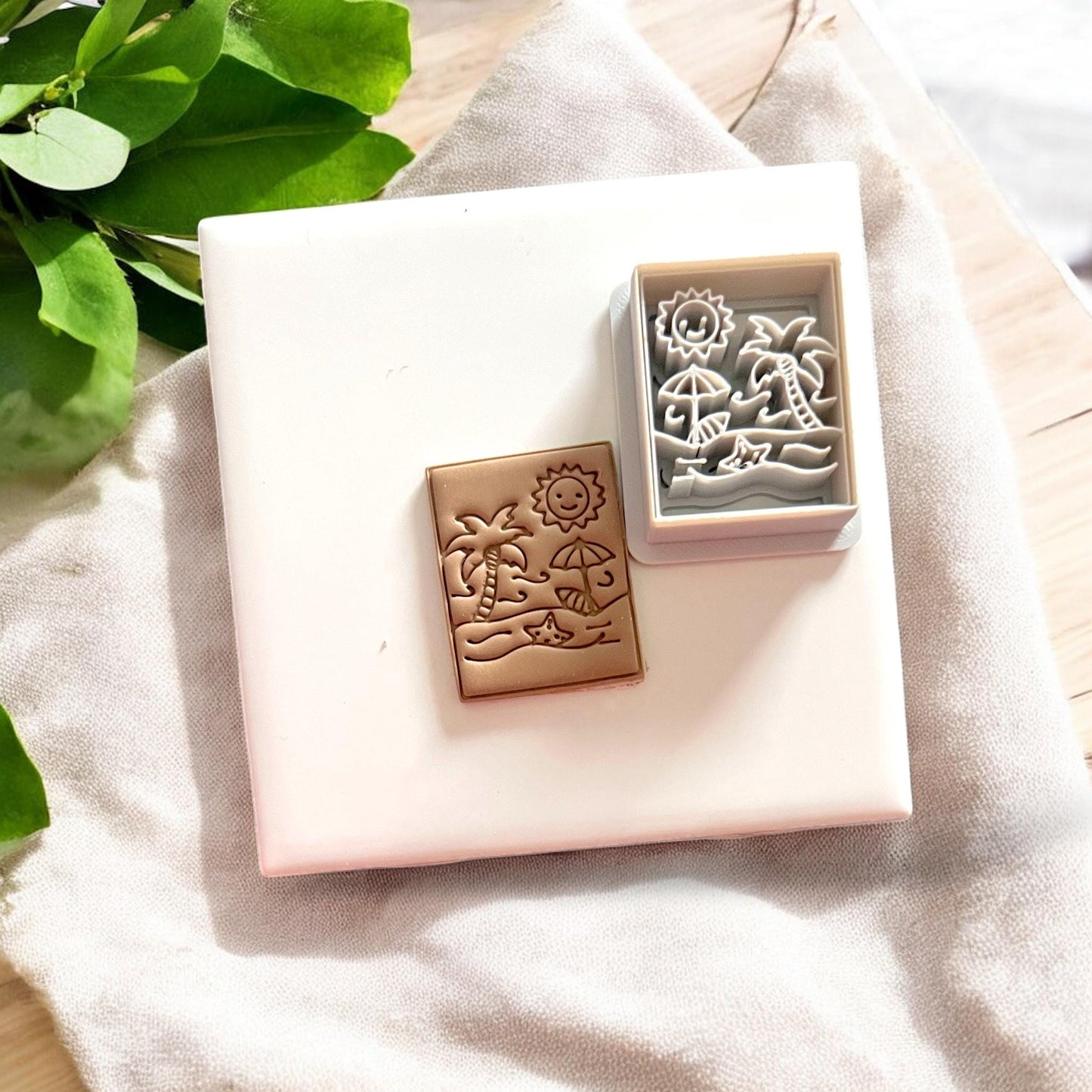 Side-by-side of finished beach clay cutout and matching cutter