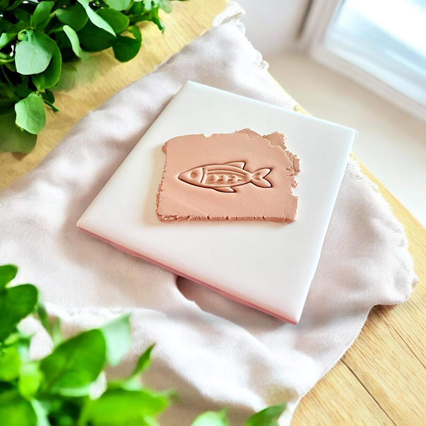 Fishbone clay cutter impression shown in slab