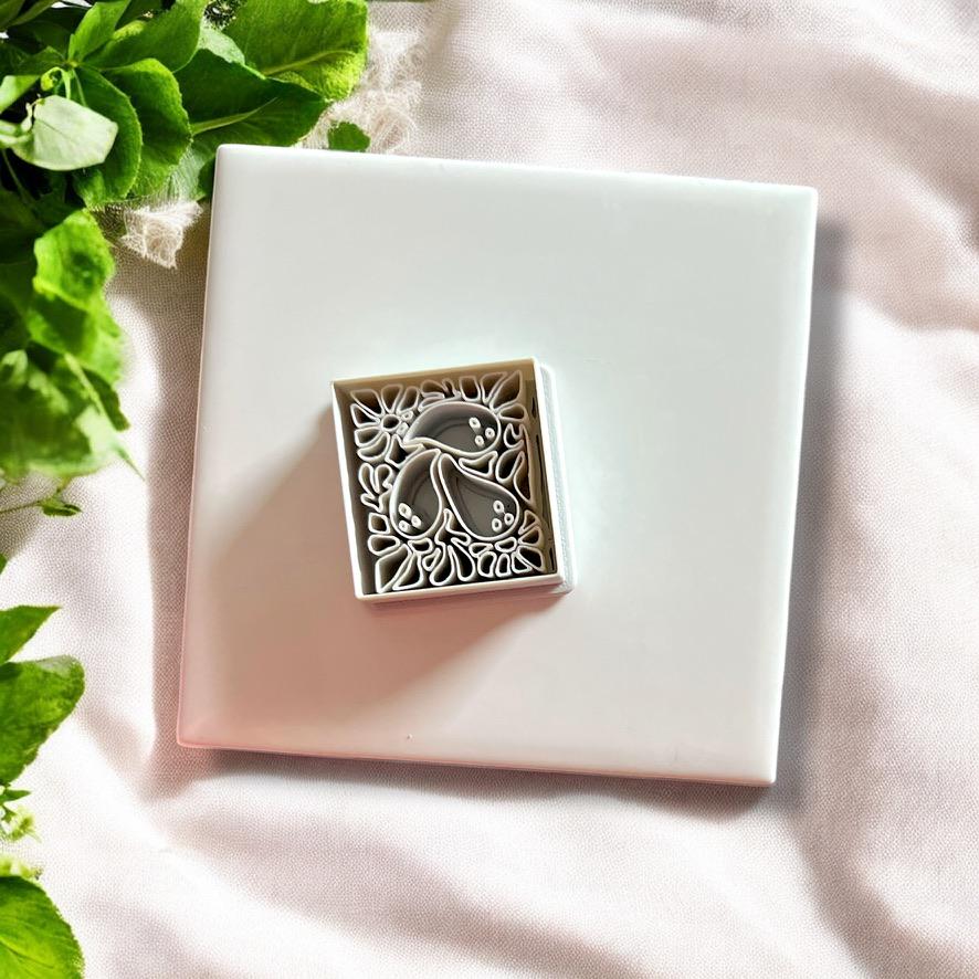 Top view of polymer clay cutter in ghost Matisse shape with floral spooky detail and compact