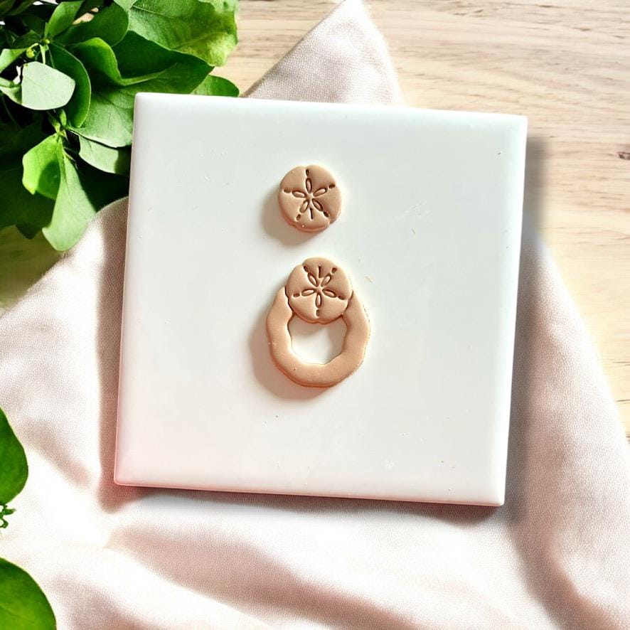 Side view of a polymer clay cutter set showcasing the layered sand dollar and base combo, great for beach-themed designs.