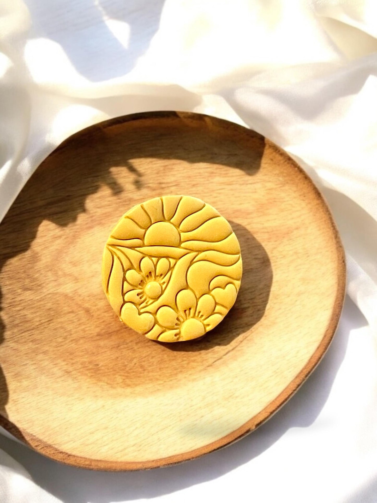 close-up of floral clay imprint for earrings
