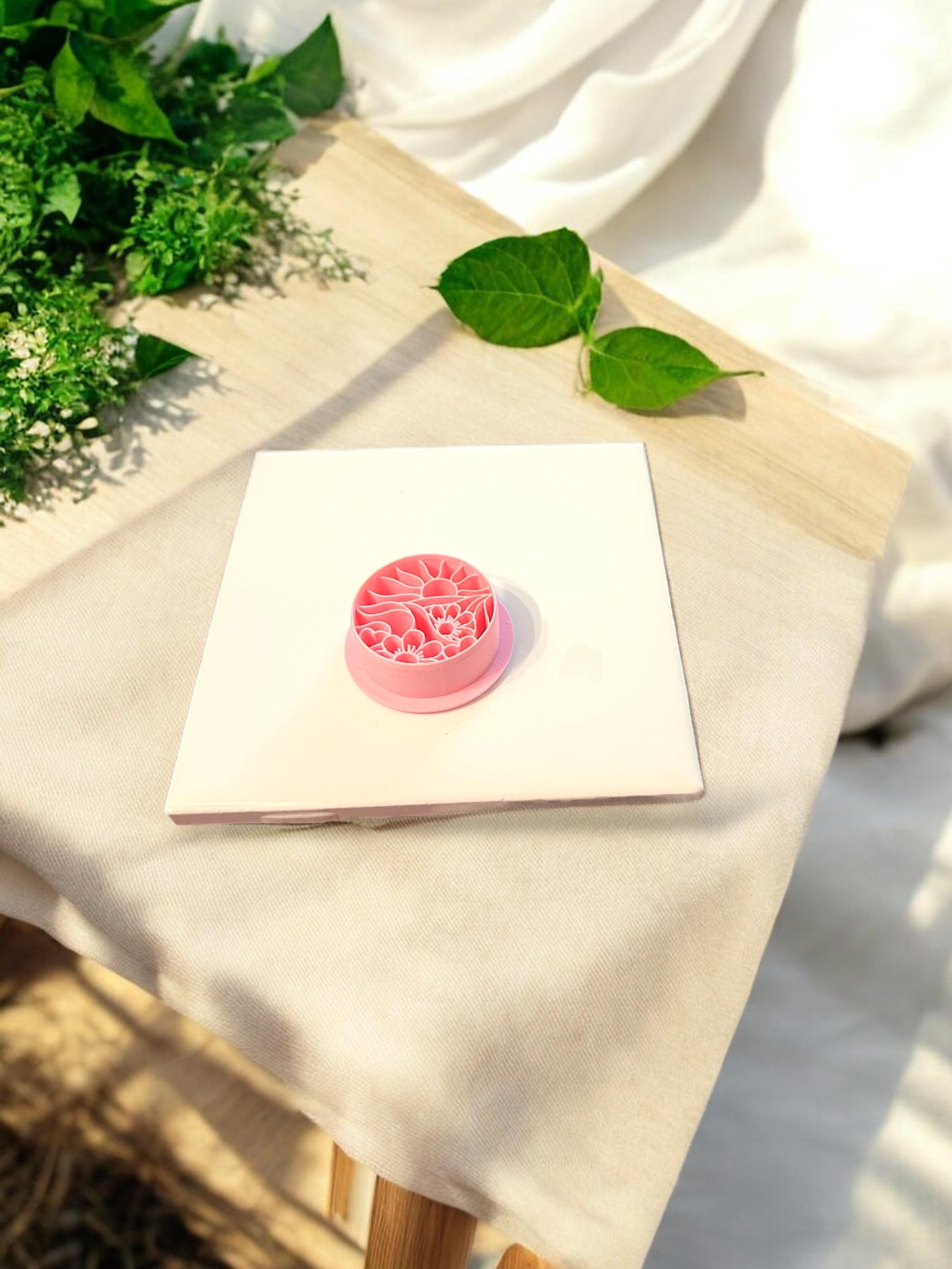 sun and flower round cutter in yellow clay