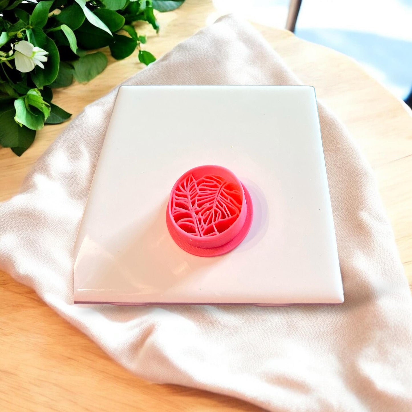 Top-down view of the pink monstera leaf clay cutter, showing detailed design for clean polymer cuts.