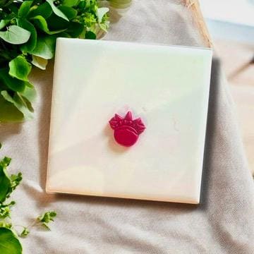 Liberty Crown polymer clay cutter displayed on a white tile with greenery in the background