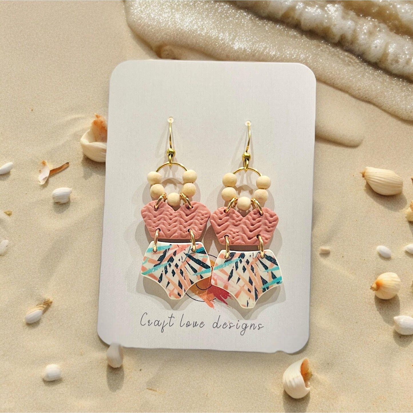 Handmade earrings created from polymer clay using the bikini top and bottom cutters, beach theme.