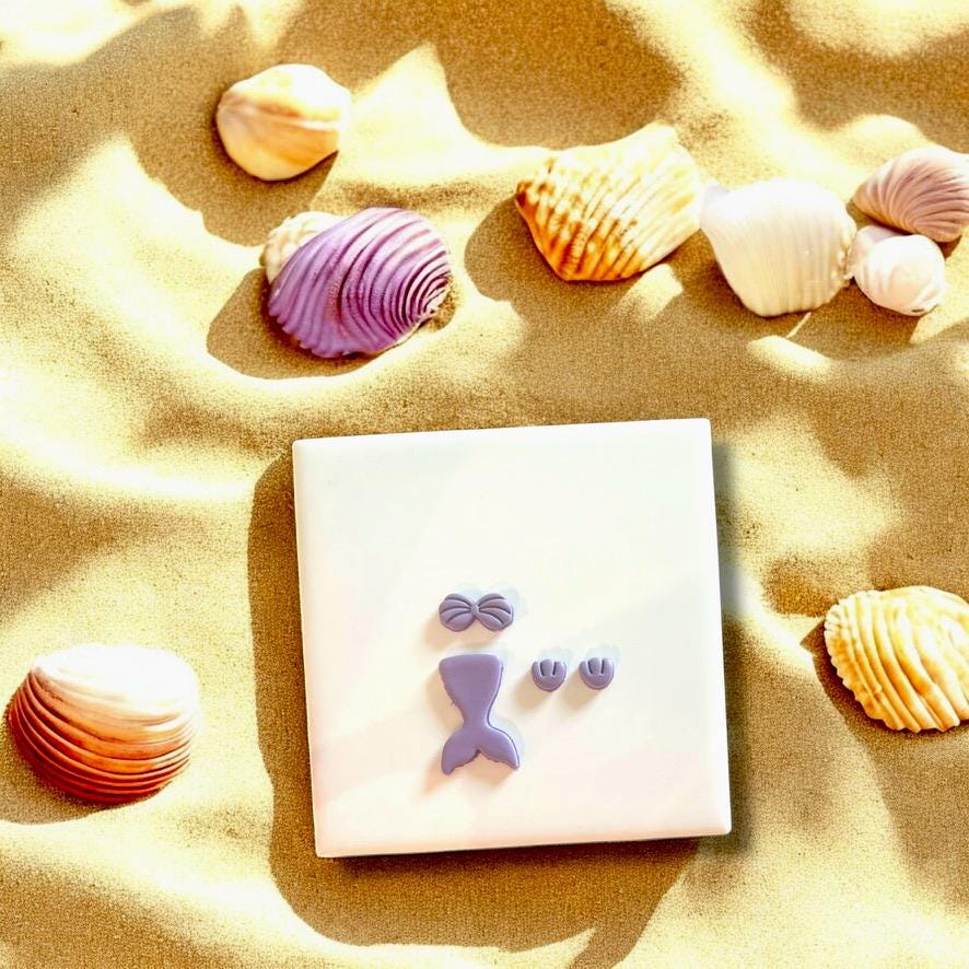 Complete mermaid tail and seashell cutter set for ocean-themed clay projects.