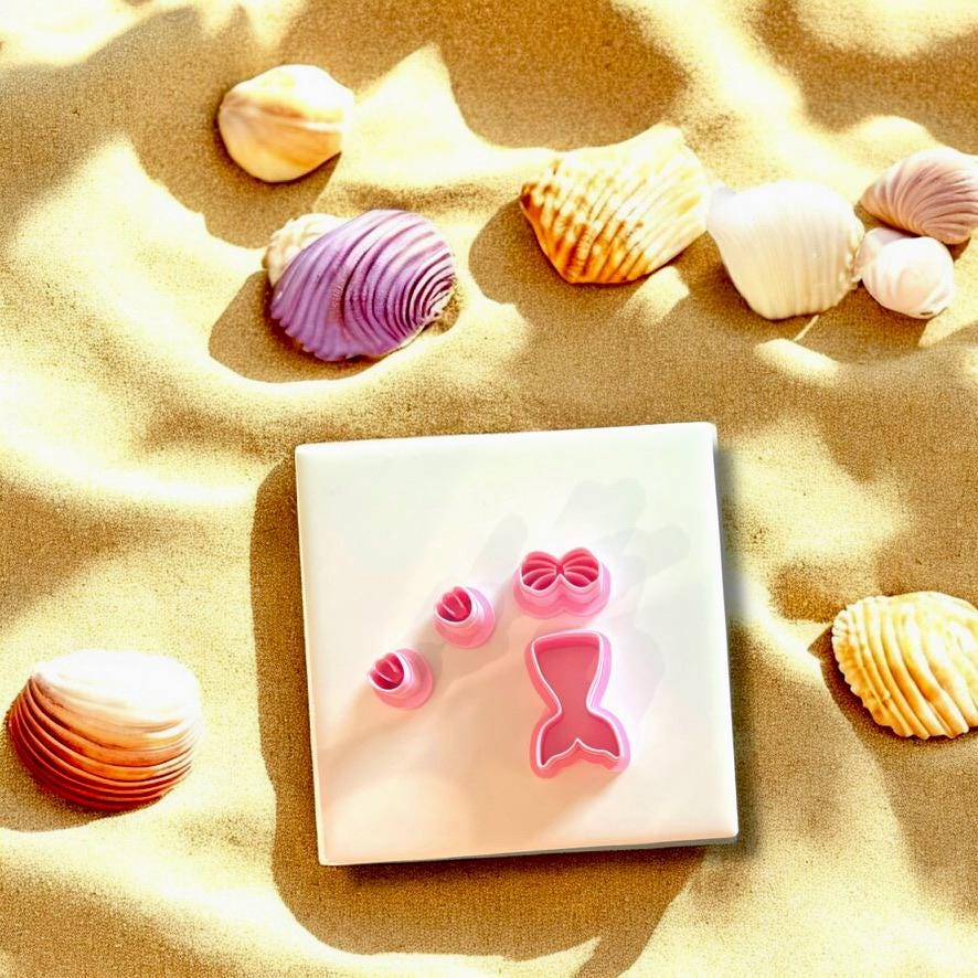 Mermaid Polymer Clay Set Full mermaid-inspired cutter set with tail, bow, and seashell tops.