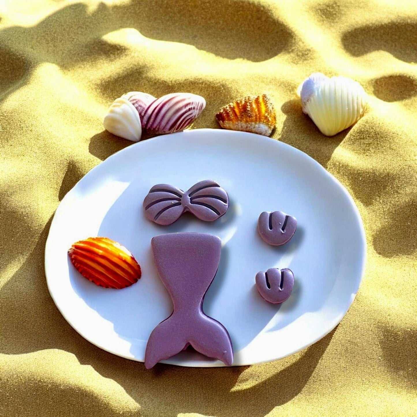 Mermaid tail polymer clay cutter mold, perfect for beach-themed earrings.