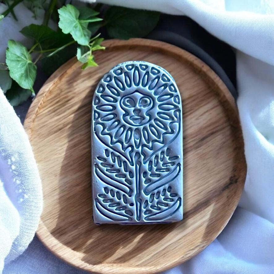 Detailed polymer clay sunflower arch component, ideal for dangle earrings and boho jewelry designs.