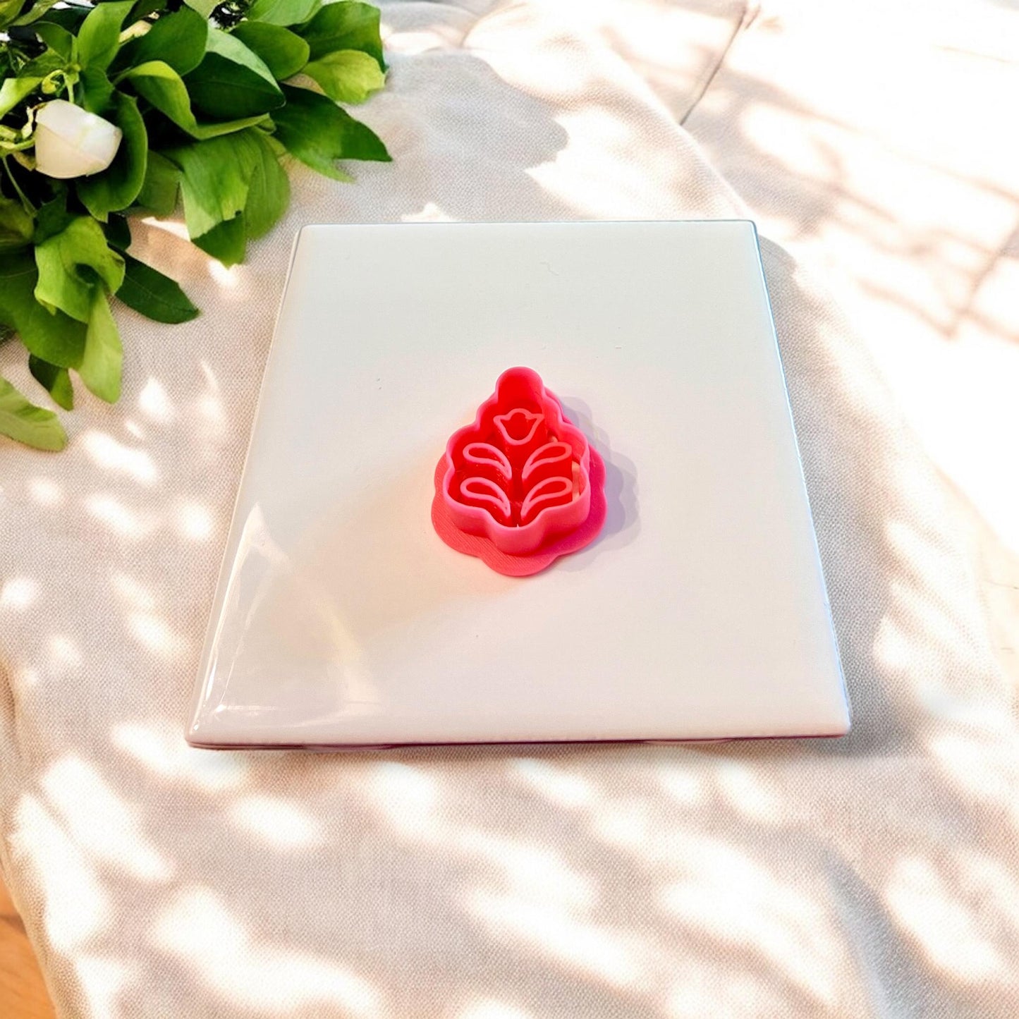 Clay cutter beside finished Scandinavian tulip clay shape