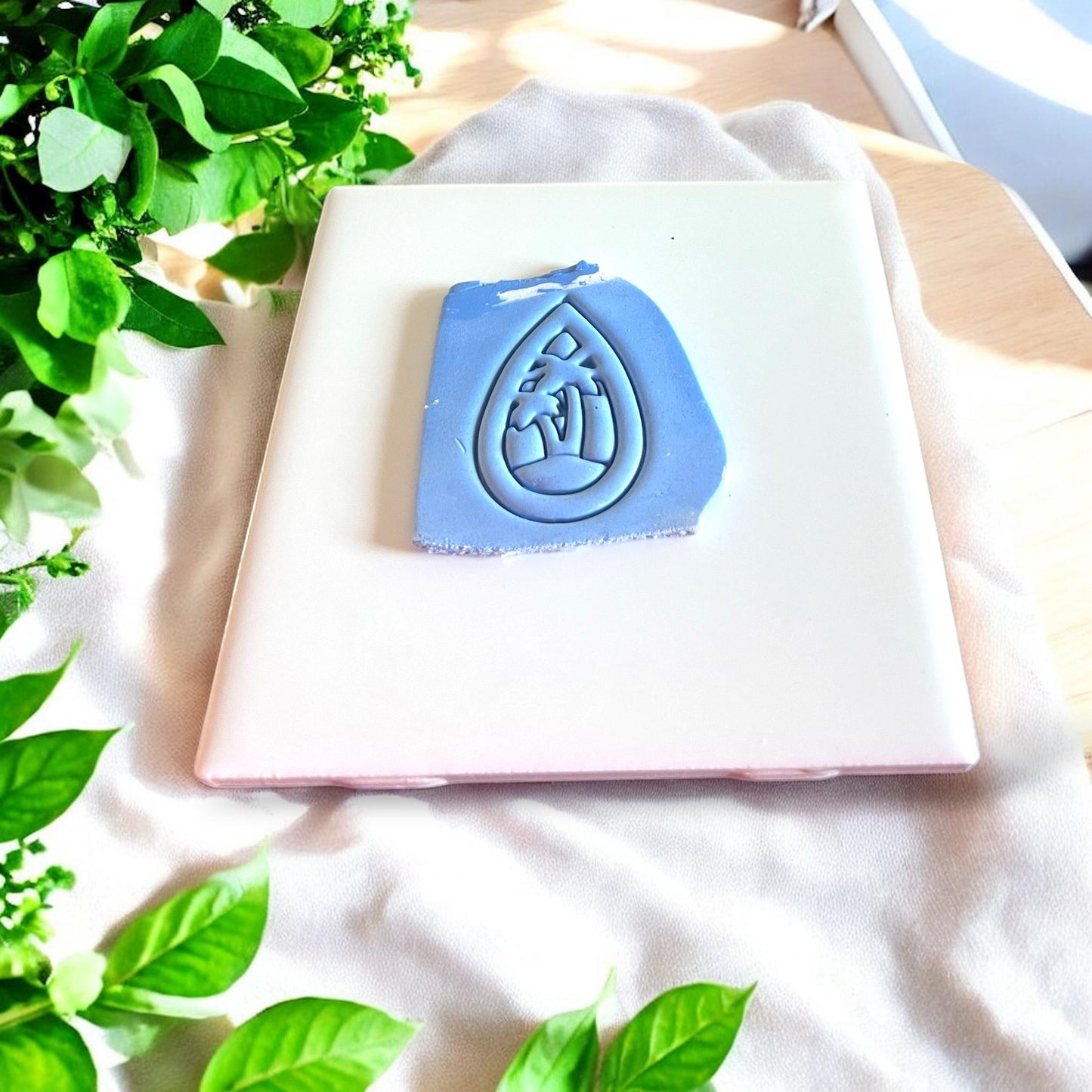 Palm tree beach clay cutter on white tile