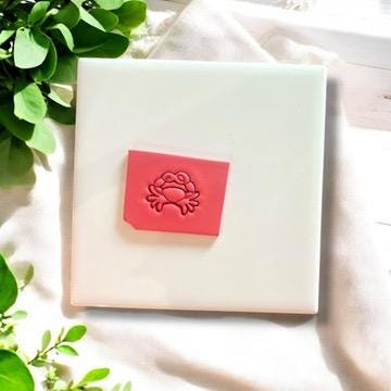 Crab polymer clay cutter on white ceramic tile