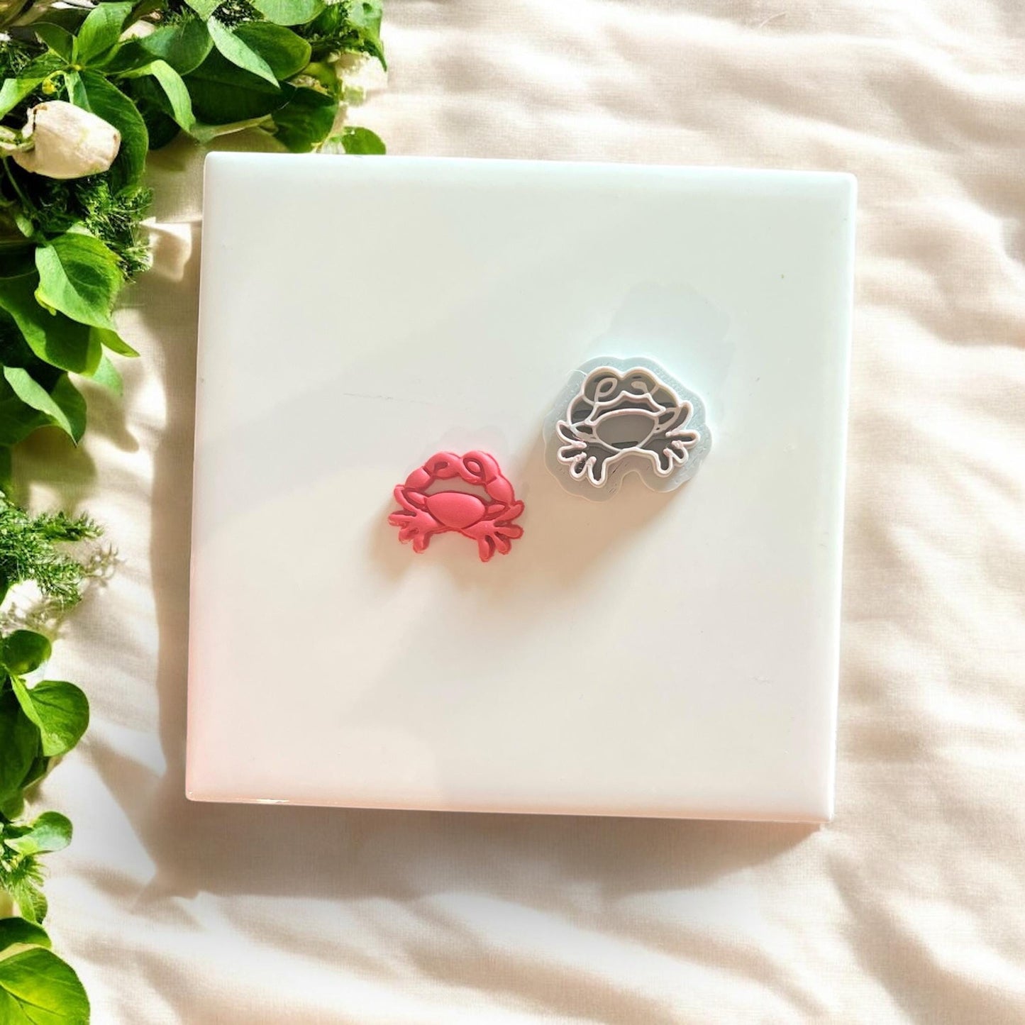 Crab polymer clay cutter with pink and gray variations