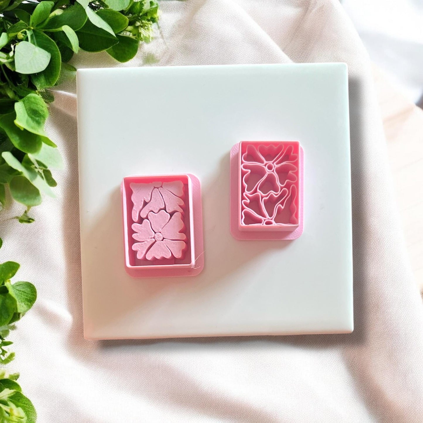 Set of Matisse flower polymer clay cutters displayed on a white surface, highlighting the intricate design.