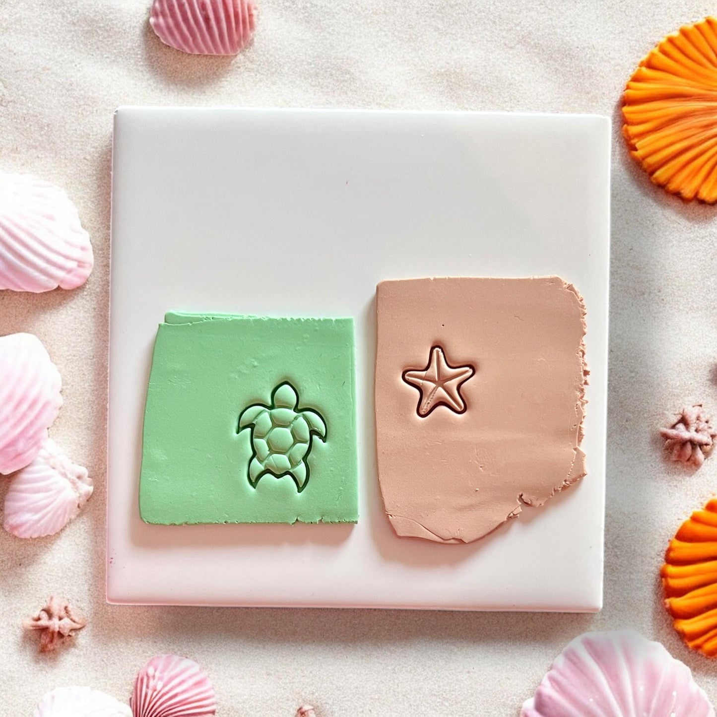 Turtle and starfish clay imprints in green and tan polymer clay