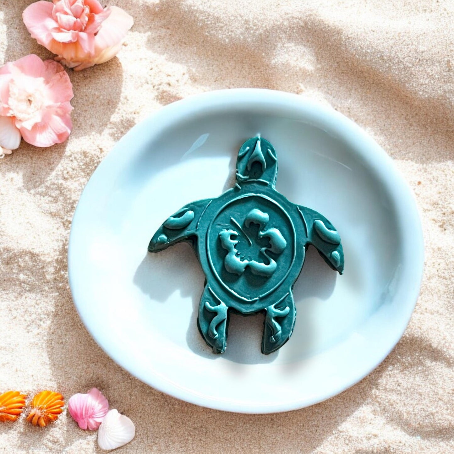 Turtle clay cutter shown with completed clay design on a square base