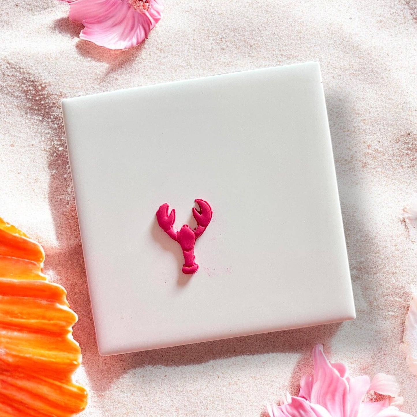 Finished small pink lobster clay cutout centered on display board