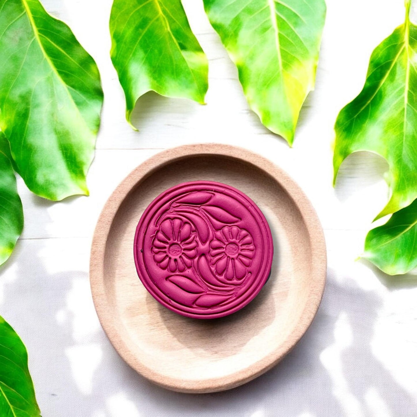Top view of floral clay cutter showing intricate daisy and leaf design