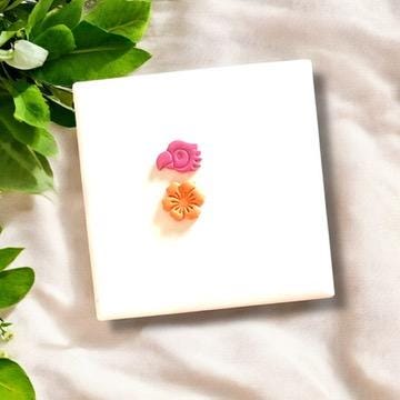 Pink parrot and orange hibiscus polymer clay charms
