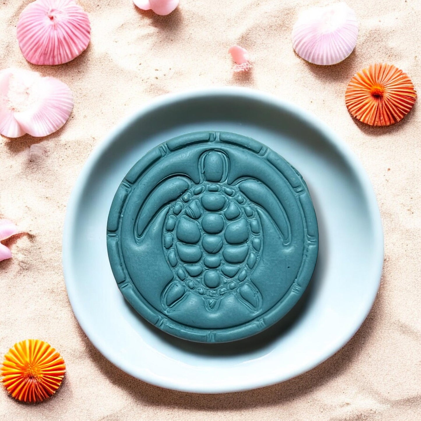 Close-up of finished sea turtle clay design on a plate with beach decor