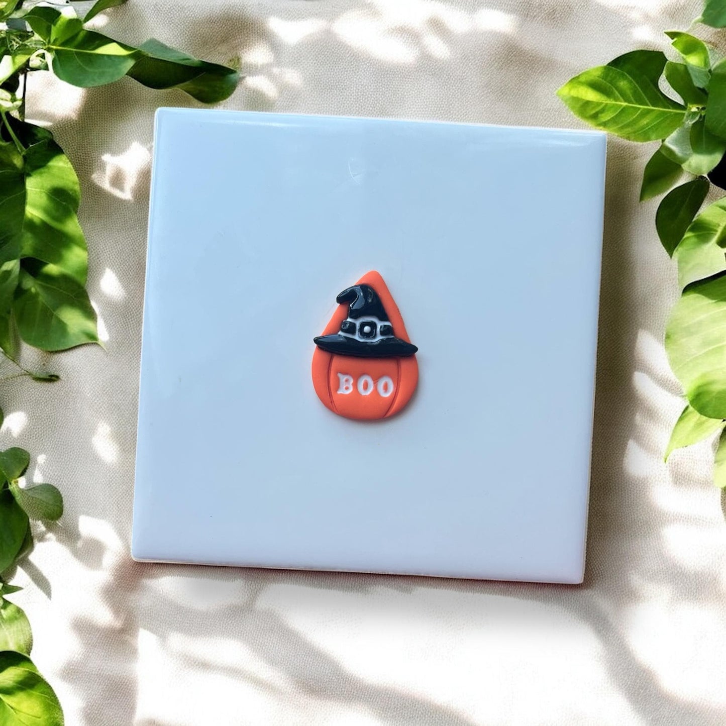 Teardrop earring with boo and hat clay detail