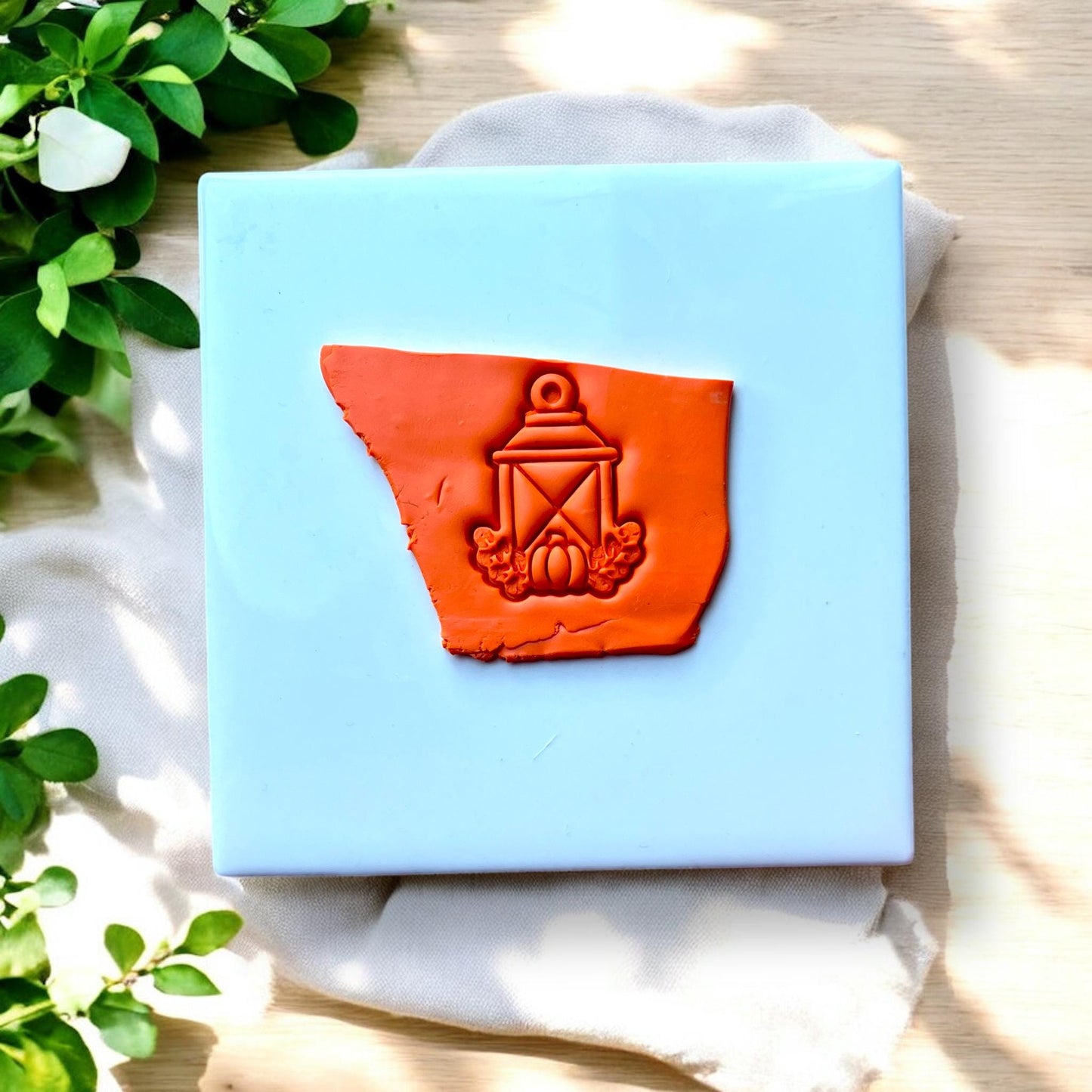 fall lantern clay impression on orange clay