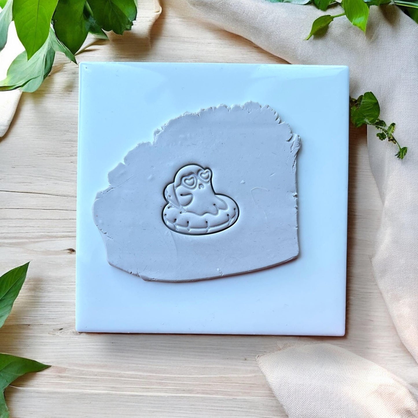 Ghost pool float impression in grey clay
